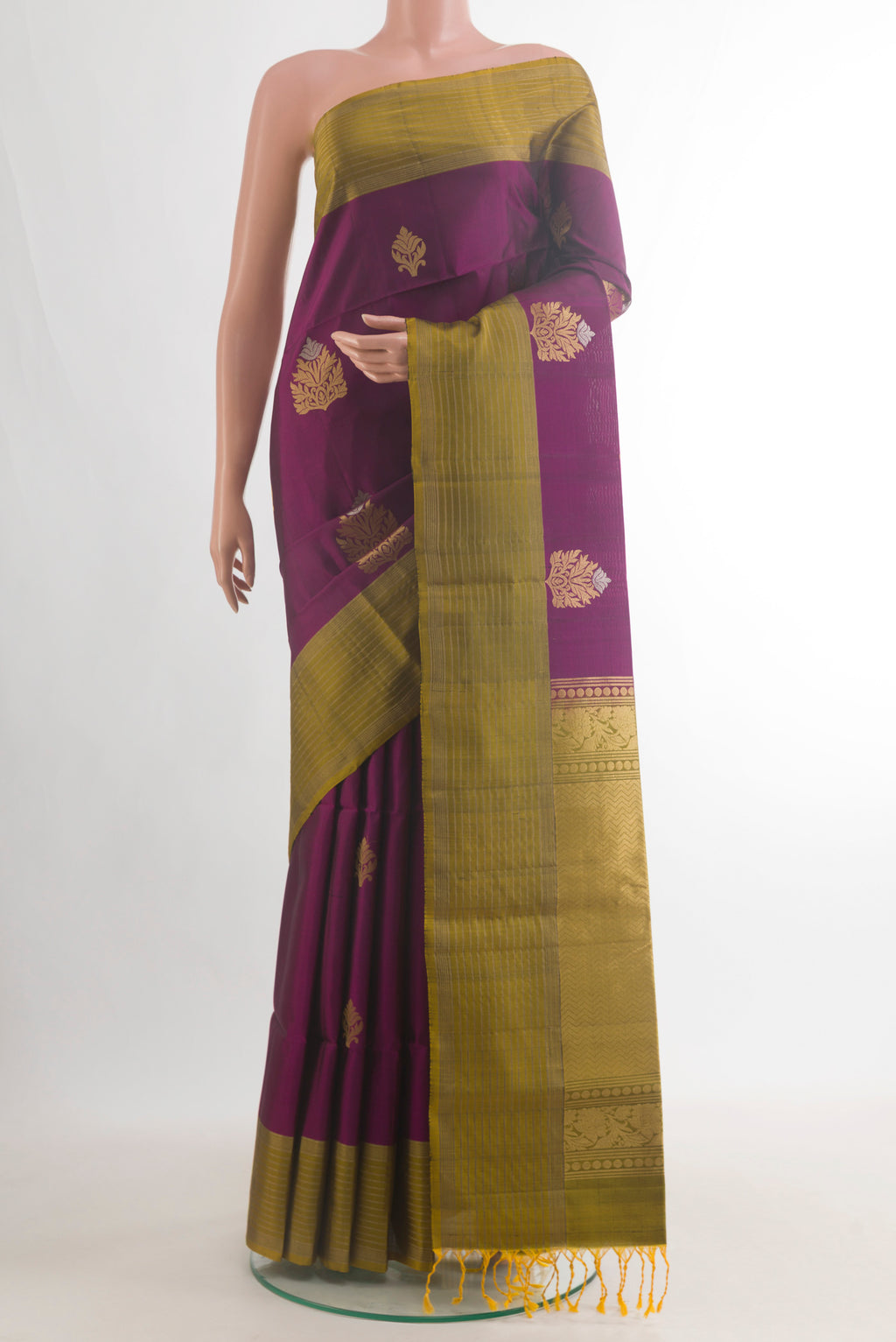 Pure Silk Purple Soft Saree with Zari Butta on the body and Zari Border.  displayed on a mannequin