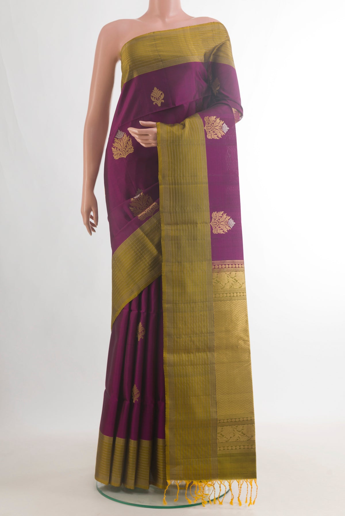 Pure Silk Purple Soft Saree with Zari Butta on the body and Zari Border.  displayed on a mannequin