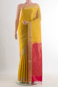 Pure Silk Yellow Soft Saree with Zari Butta on the body and Zari Border.  displayed on a mannequin
