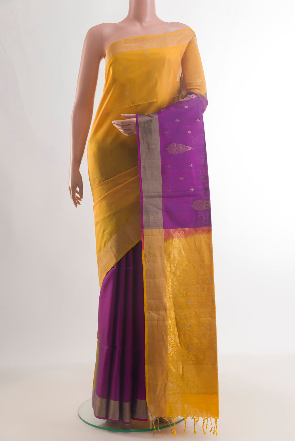Pure Silk Multi Color Soft Saree with Half And Half on the body and Zari Border.  displayed on a mannequin