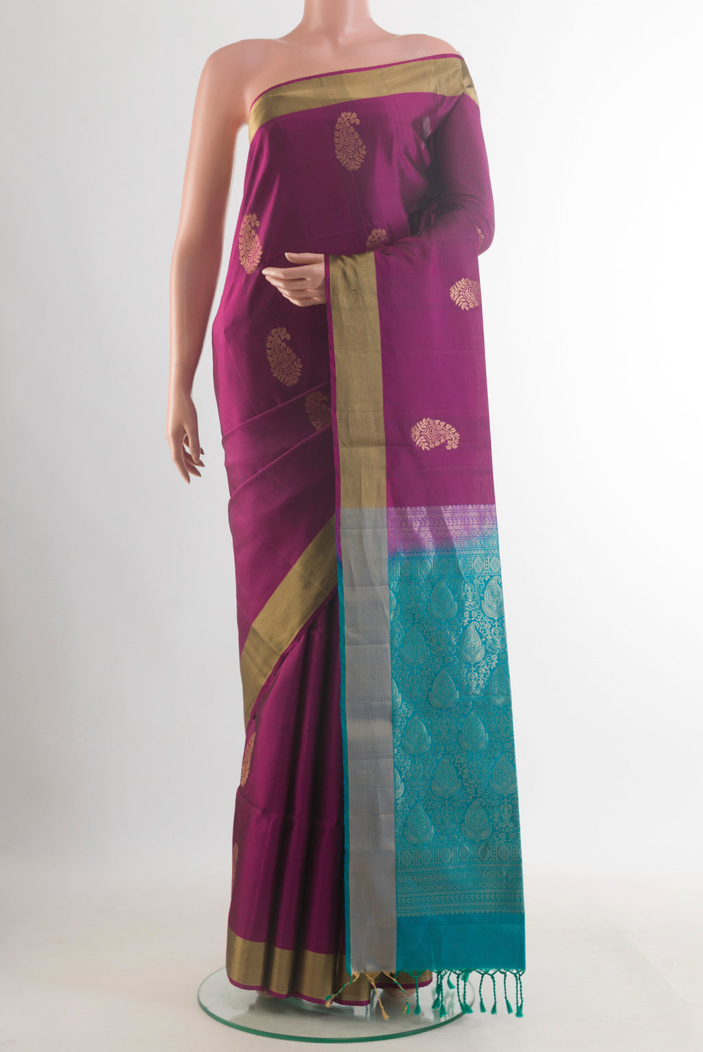 Pure Silk Purple Soft Saree with Zari Butta on the body and Zari Border.  displayed on a mannequin