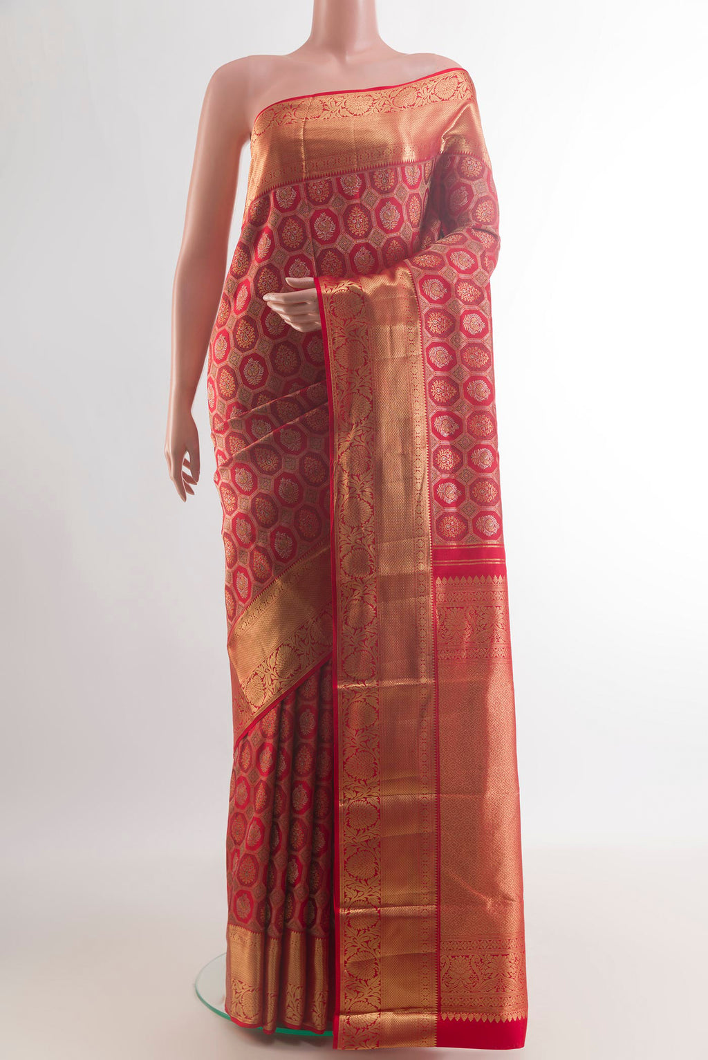 Pure Silk Red Kanjivaram Saree with Zari Brocade on the body and Zari Border.  displayed on a mannequin