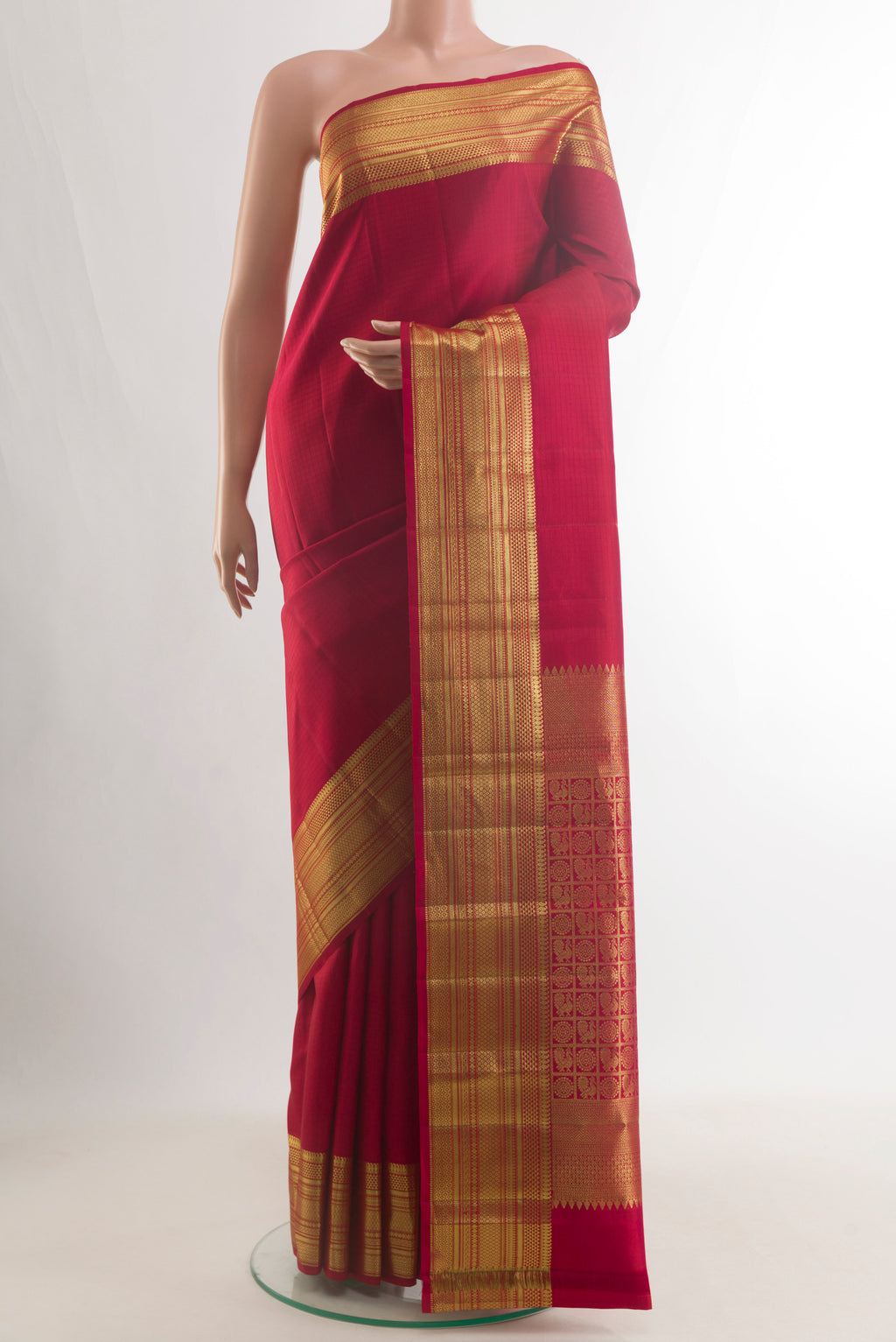 Pure Silk Red Kanjivaram Saree with Checked design on the body and Zari Border.  displayed on a mannequin