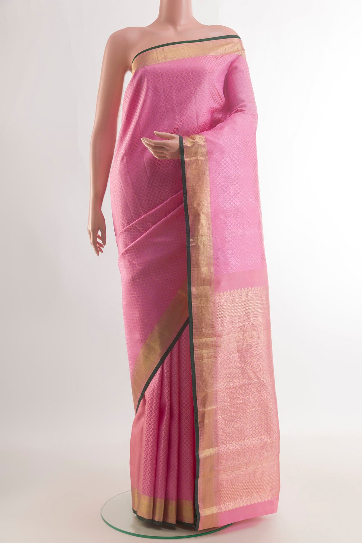 Pure Silk Pink Kanjivaram Saree with Jacquard design on the body and Zari Border.  displayed on a mannequin