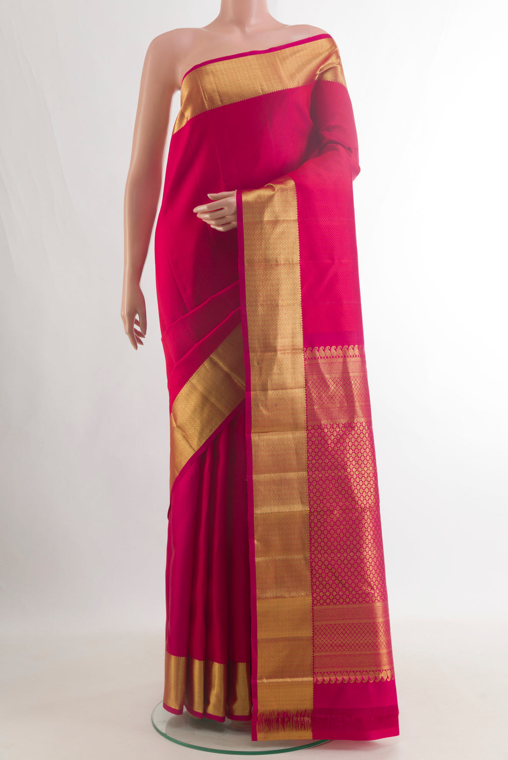 Pure Silk Dark Pink Kanjivaram Saree with Jacquard design on the body and Zari Border.  displayed on a mannequin