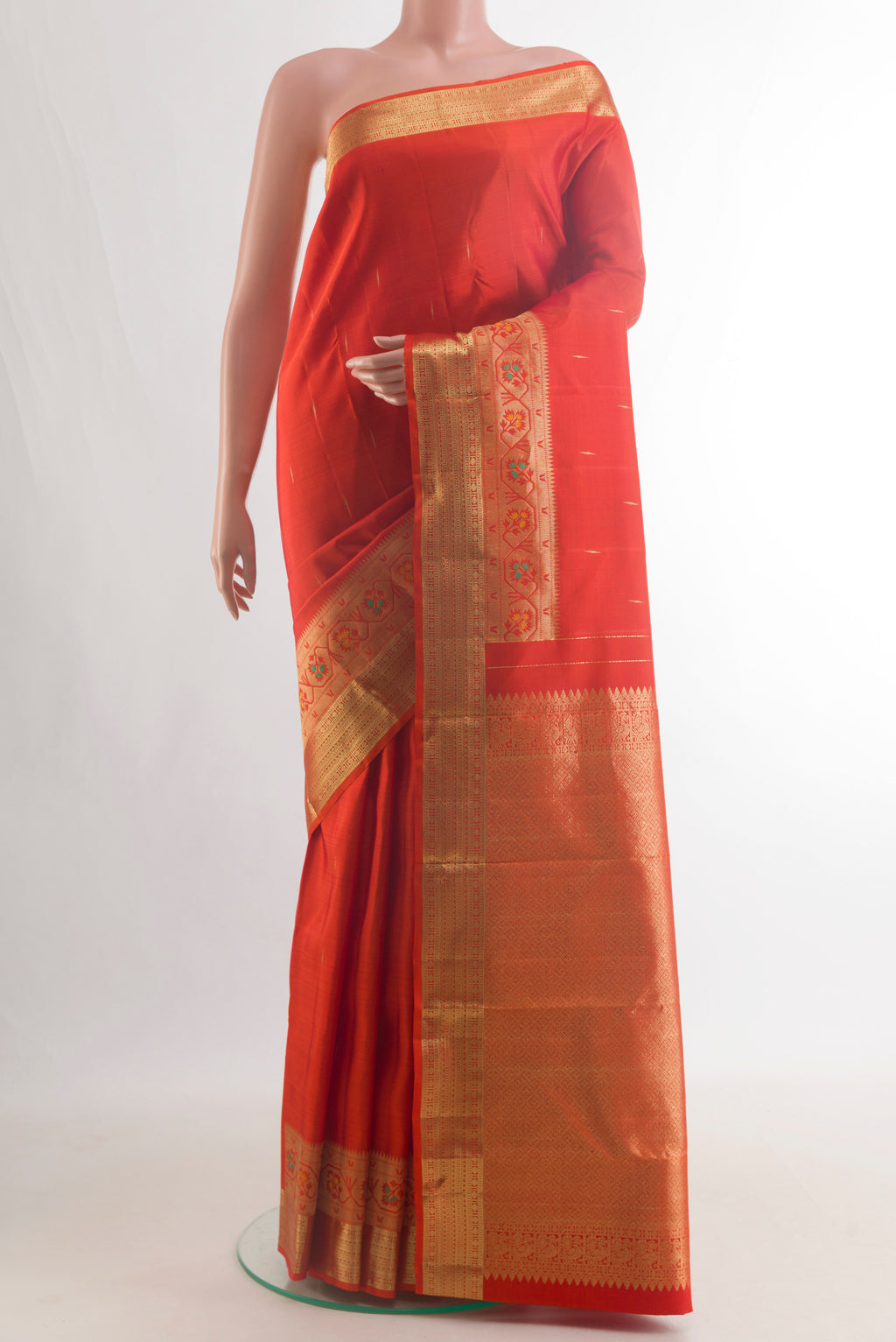 Pure Silk Orange Kanjivaram Saree with Zari Butta on the body and Paithani Border.  displayed on a mannequin