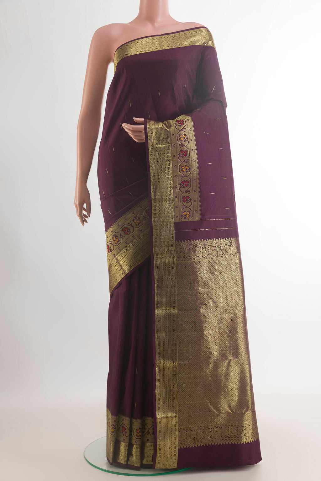 Pure Silk Coffee Brown Kanjivaram Saree with Zari Butta on the body and Zari Border.  displayed on a mannequin