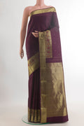 Pure Silk Coffee Brown Kanjivaram Saree with Zari Butta on the body and Zari Border.  displayed on a mannequin