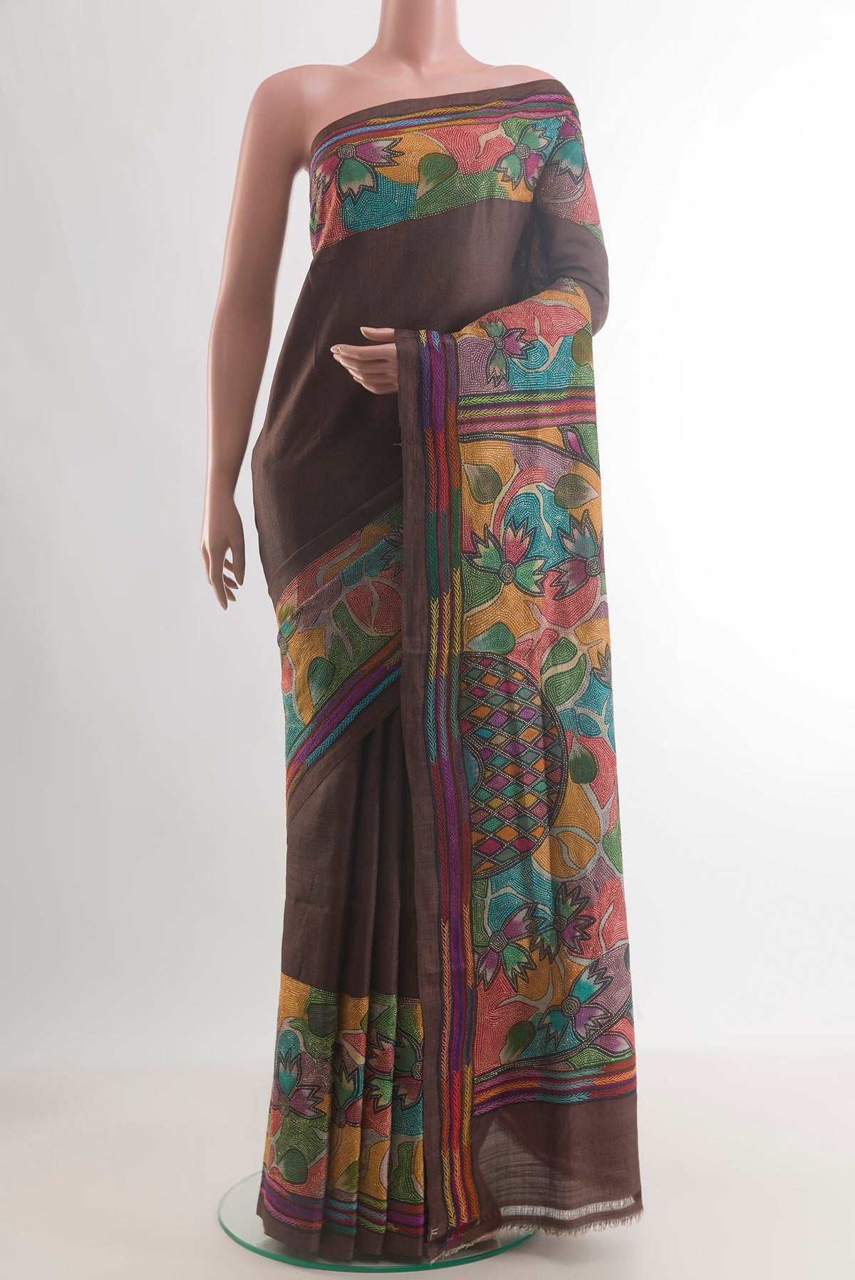 Brown Tussar Saree with Kantha Work on the body and Embroidery Border.  displayed on a mannequin