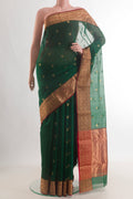 Green Chanderi Cotton Saree with Zari Butta on the body and Zari Border.  displayed on a mannequin