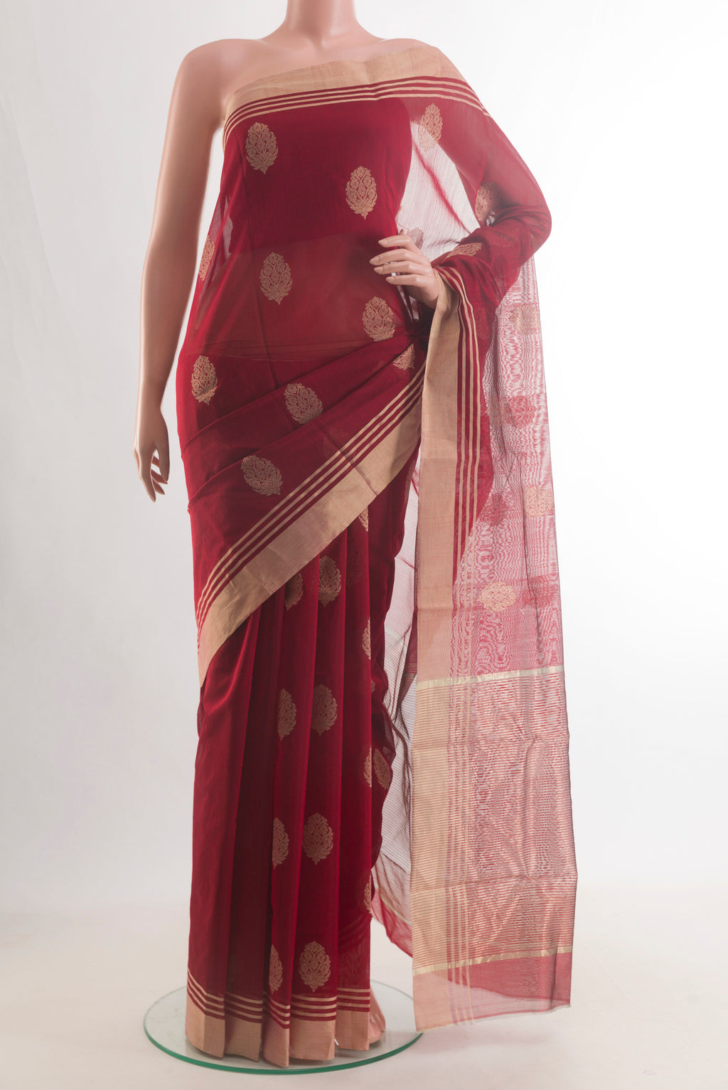 Maroon Chanderi Cotton Saree with Zari Butta on the body and Zari Border.  displayed on a mannequin