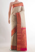 Pure Silk Beige Kanchipuram Saree with Plain Body and Zari Border.  displayed on a mannequin
