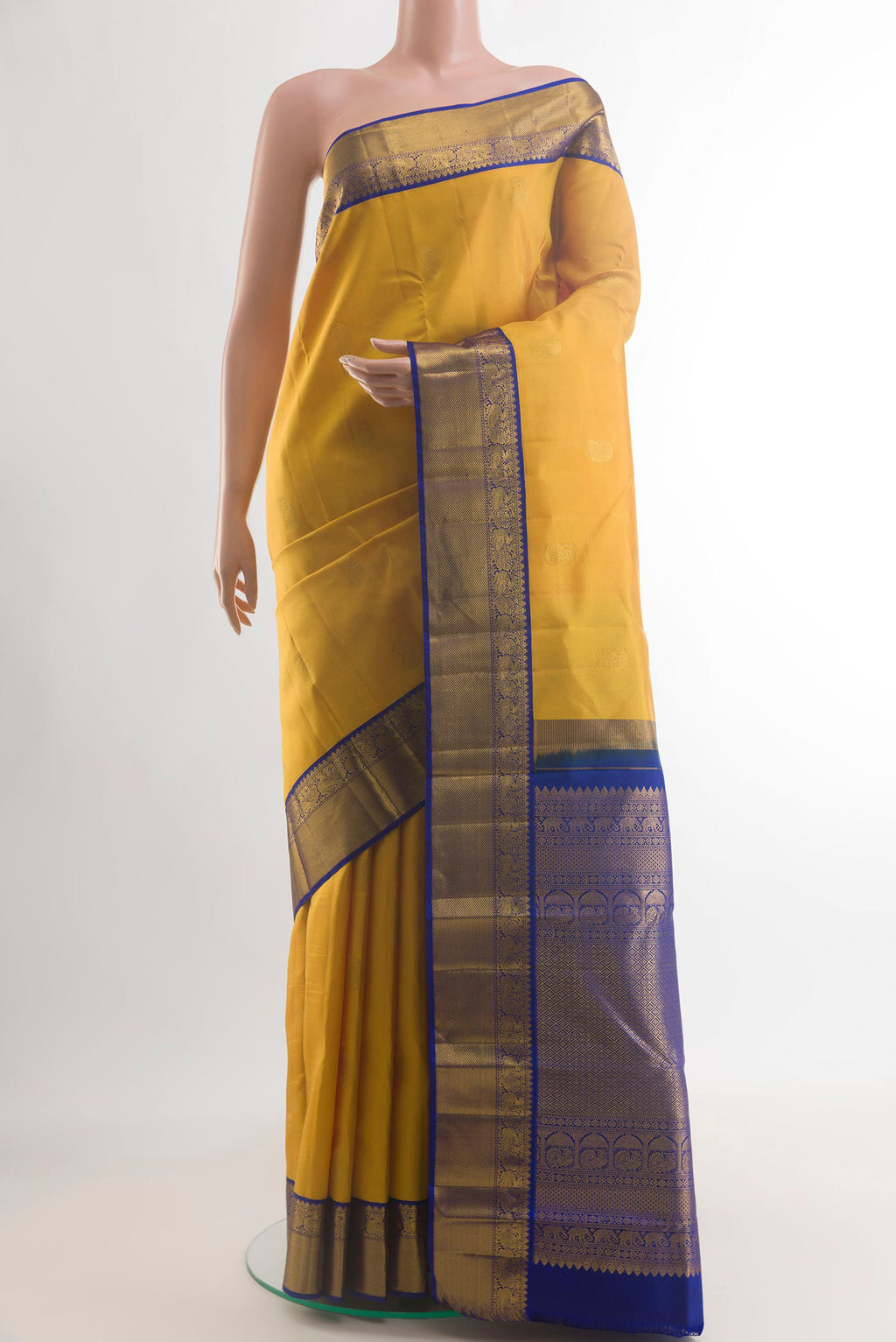 Pure Silk Yellow Kanjivaram Saree with Zari Butta on the body and Zari Border.  displayed on a mannequin