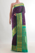 Pure Silk Purple Kanjivaram Saree with Zari Butta on the body and Zari Border.  displayed on a mannequin