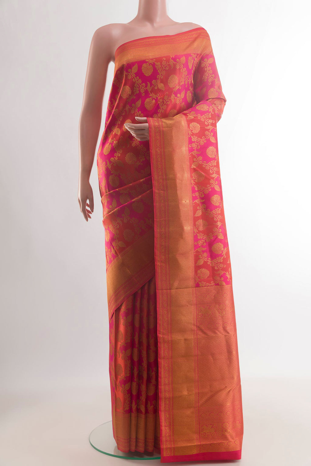 Pure Silk Orange Kanjivaram Saree with Zari Brocade on the body and Zari Border.  displayed on a mannequin