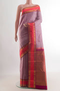 Pure Silk Rose Gold Kanchipuram Saree with Zari Butta on the body and Zari Border.  displayed on a mannequin