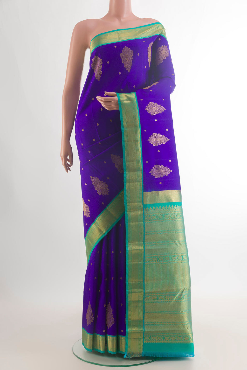 Pure Silk Royal Blue Kanchipuram Saree with Zari Butta on the body and Zari Border.  displayed on a mannequin