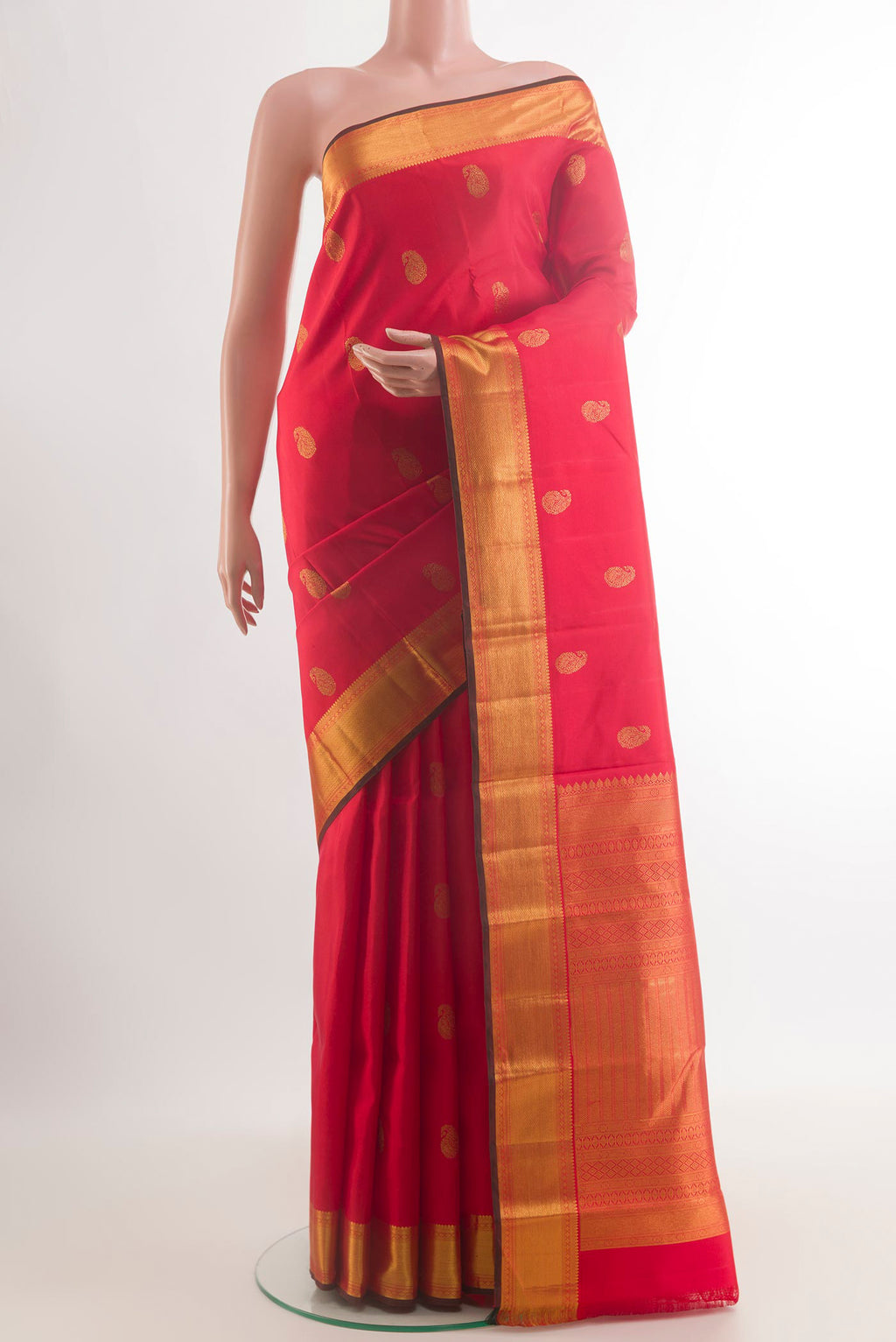 Pure Silk Red Kanchipuram Saree with Zari Butta on the body and Zari Border.  displayed on a mannequin