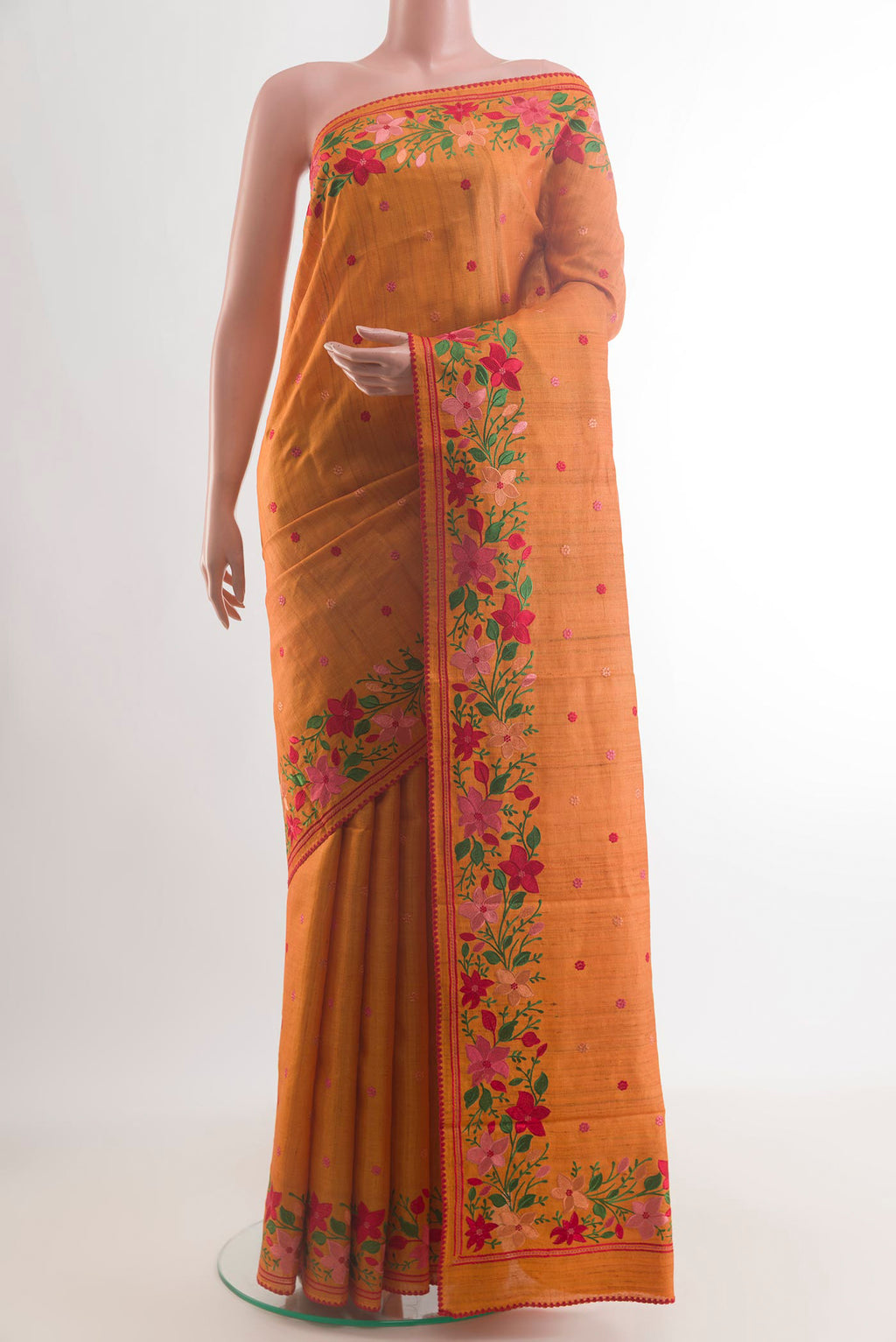 Yellow Tussar Saree with Embroidery on the body and Embroidery Border.  displayed on a mannequin