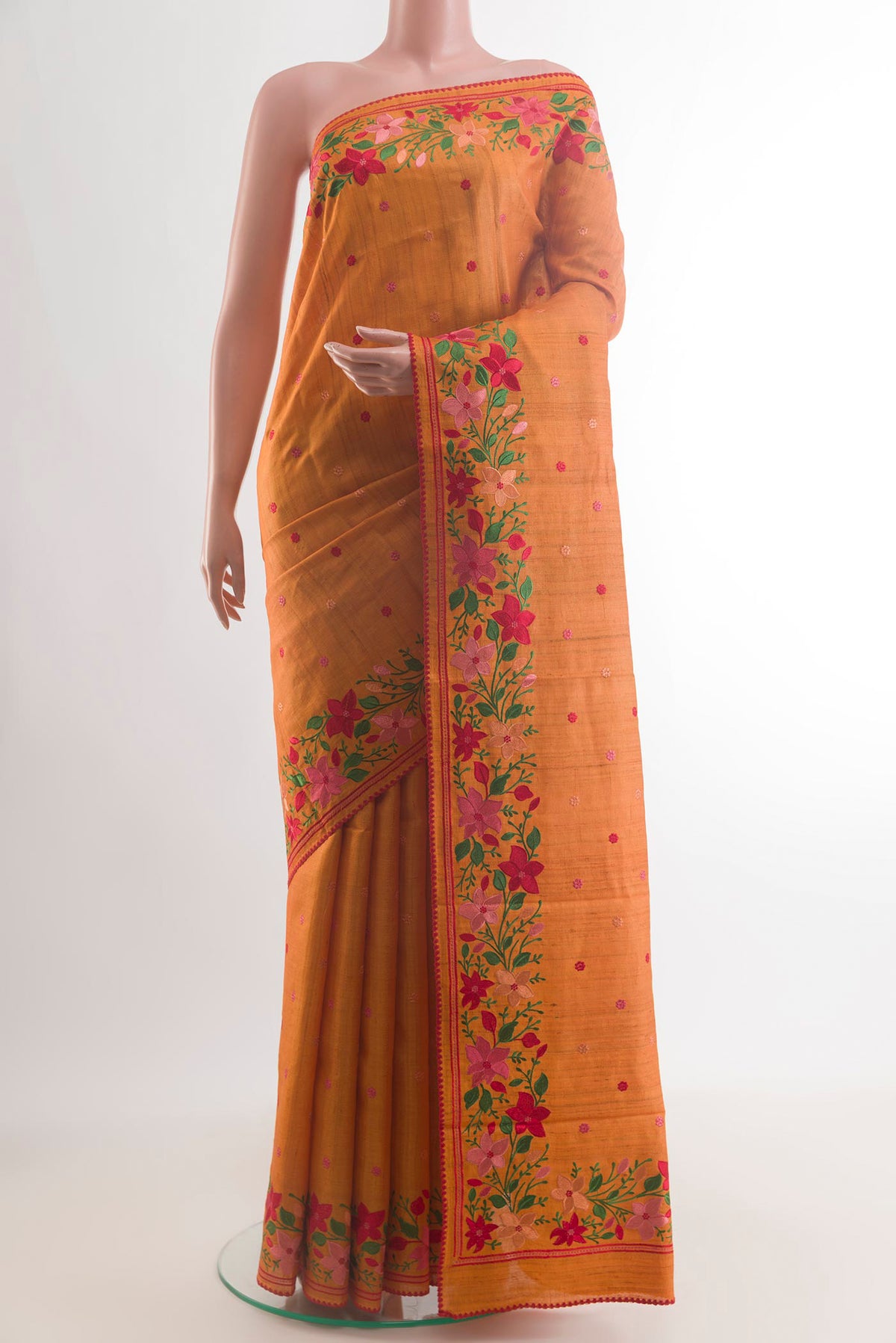 Yellow Tussar Saree with Embroidery on the body and Embroidery Border.  displayed on a mannequin