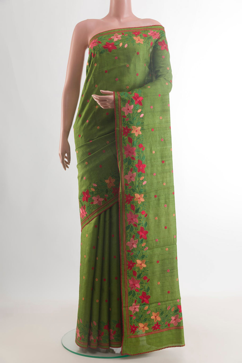 Mehandi Green Tussar Saree with Embroidery on the body and Embroidery Border.  displayed on a mannequin