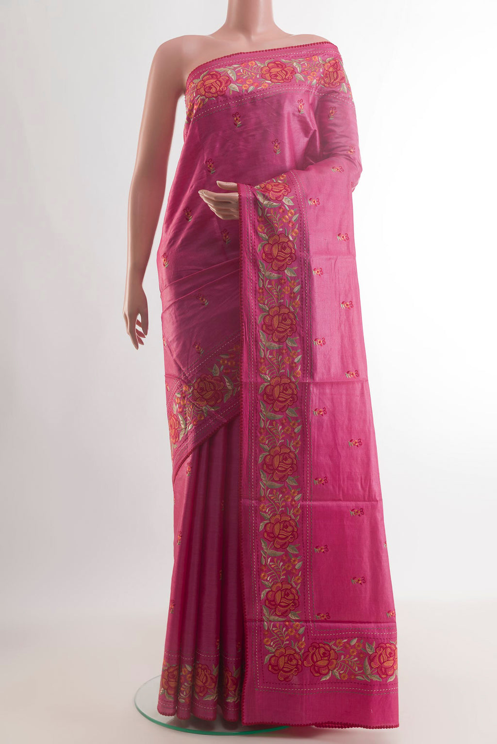 Pink Tussar Saree with Embroidery on the body and Embroidery Border.  displayed on a mannequin
