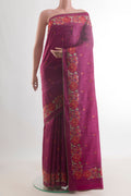 Magenta Tussar Saree with Embroidery on the body and Embroidery Border.  displayed on a mannequin