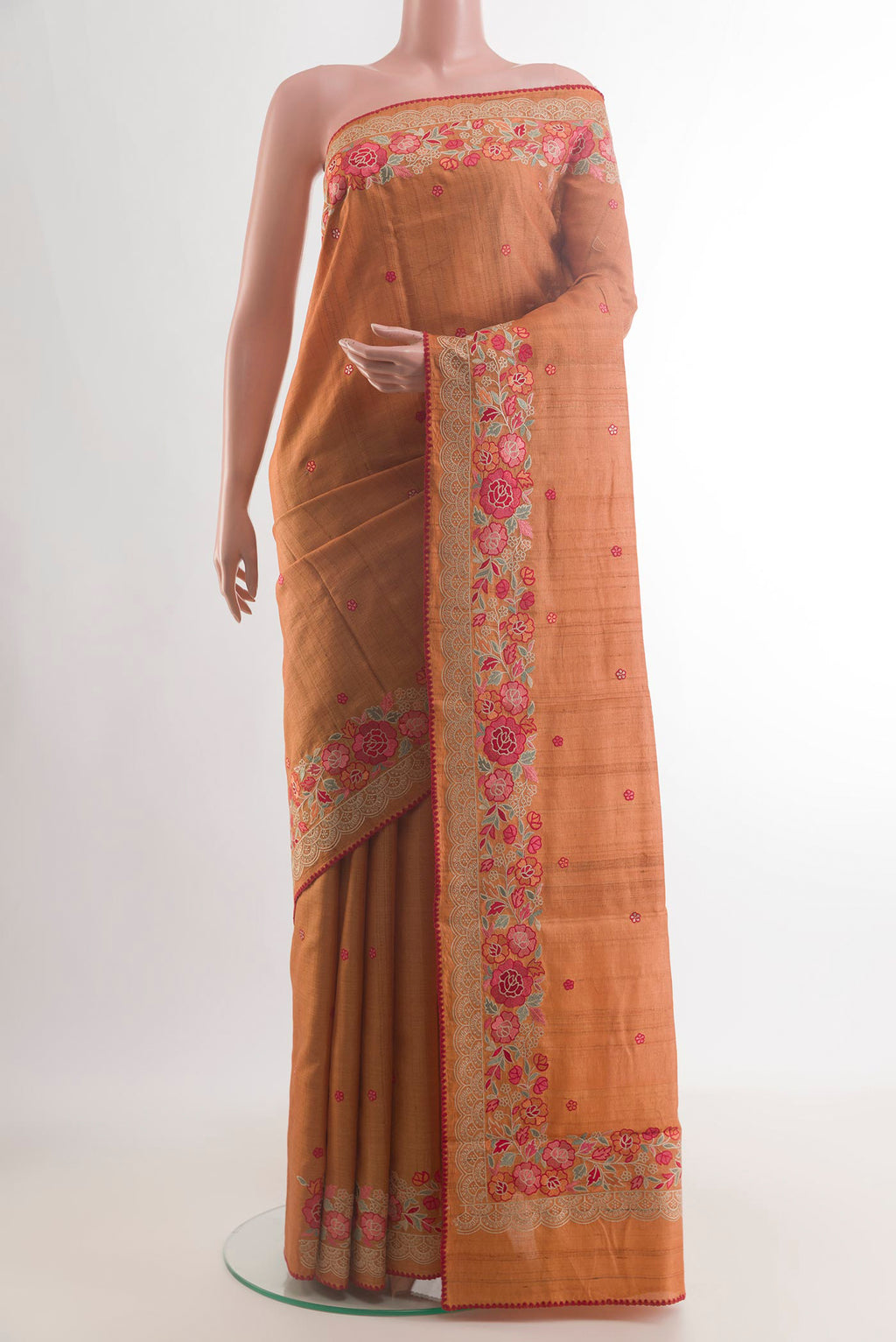 Mustard Tussar Saree with Embroidery on the body and Embroidery Border.  displayed on a mannequin