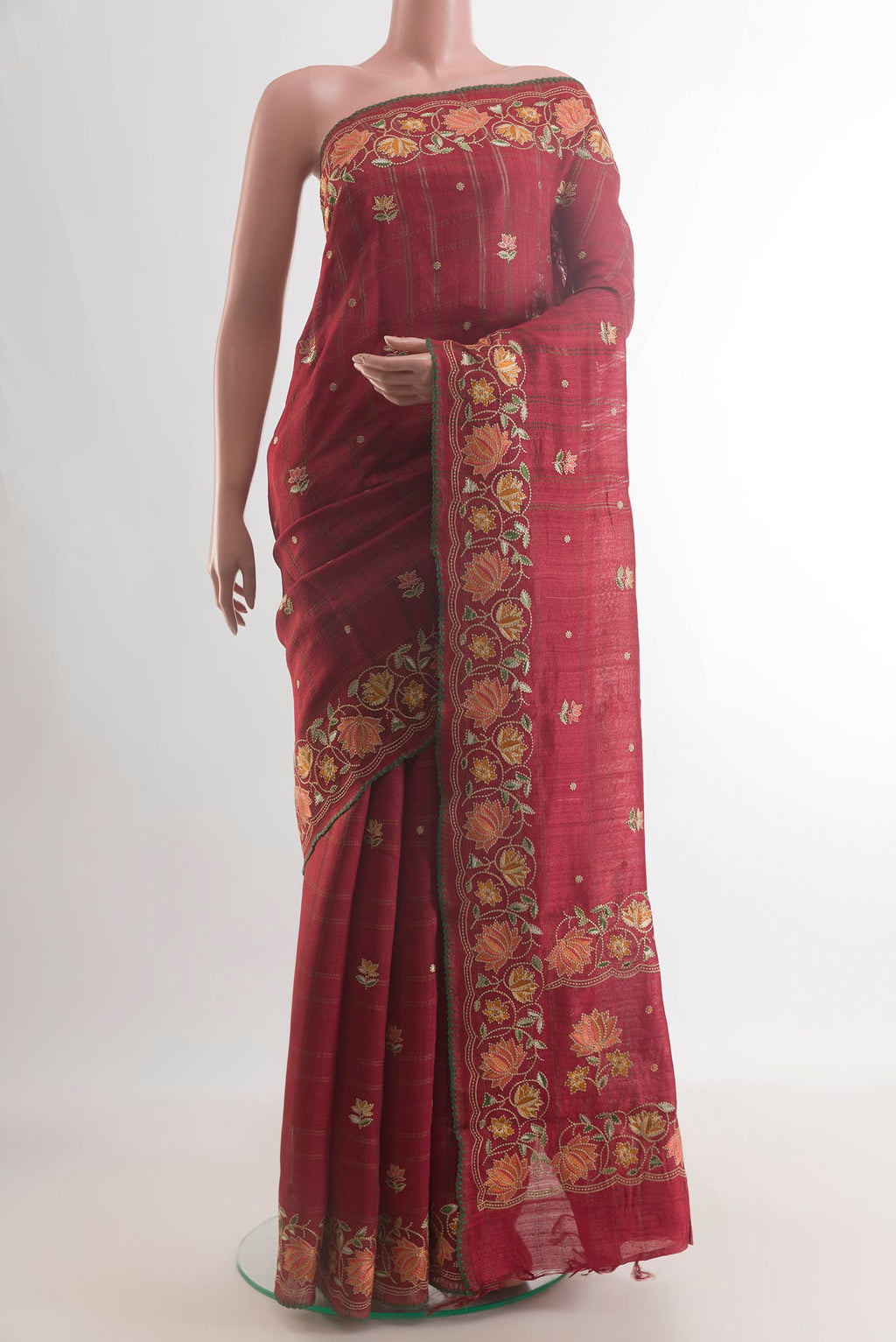 Maroon Tussar Saree with Embroidery on the body and Embroidery Border.  displayed on a mannequin