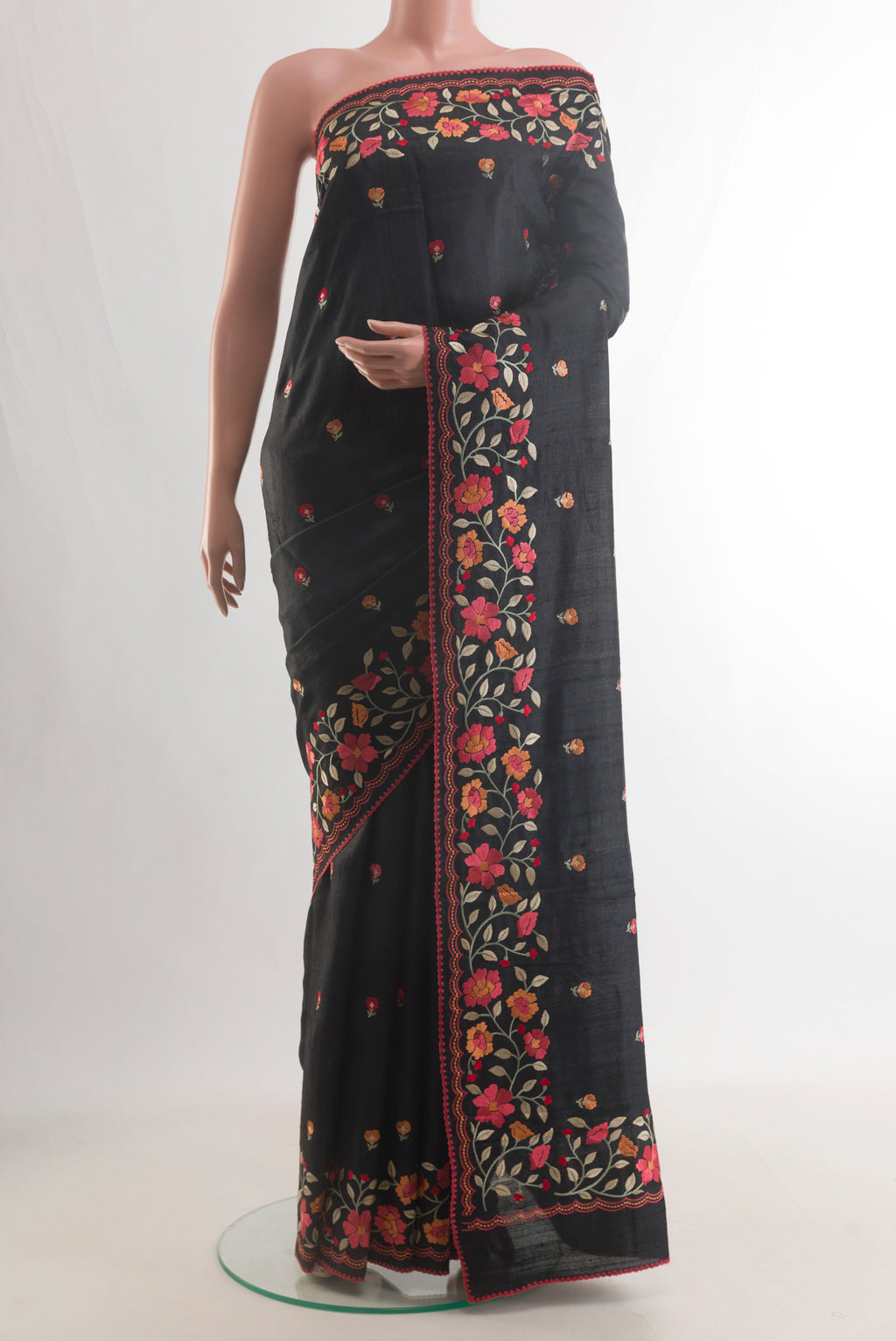 Black Tussar Saree with Embroidery on the body and Embroidery Border.  displayed on a mannequin