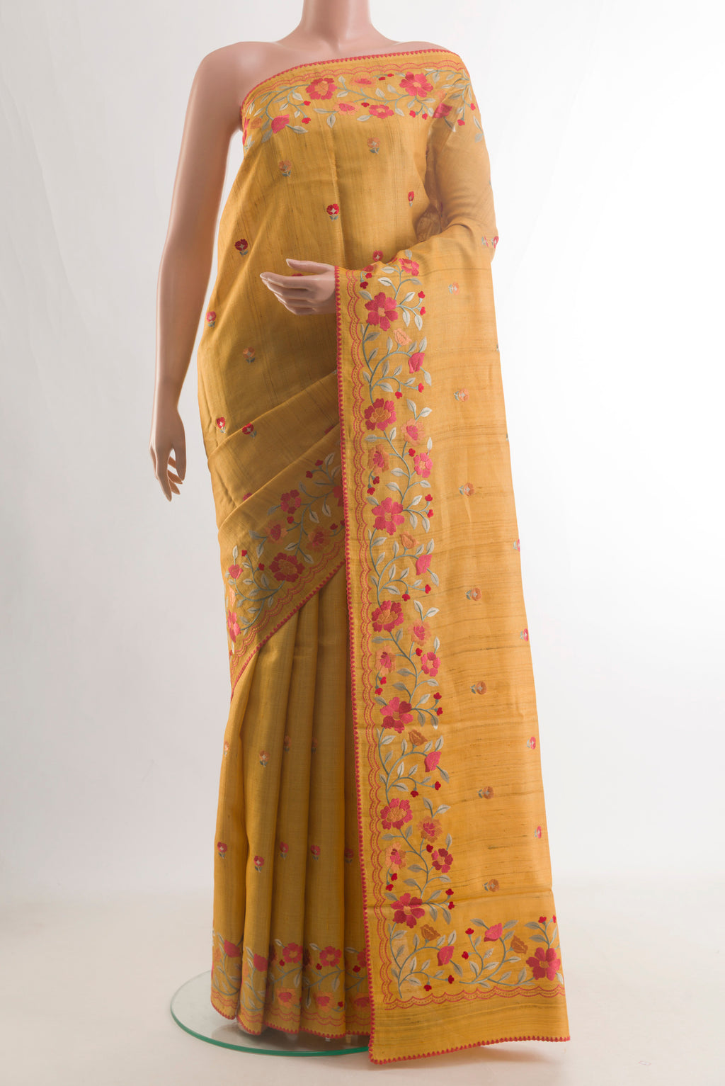 Yellow Tussar Saree with Embroidery on the body and Embroidery Border.  displayed on a mannequin