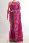 Pink Tussar Saree with Embroidery on the body and Embroidery Border.  displayed on a mannequin