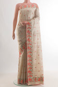 Cream Tussar Saree with Embroidery on the body and Embroidery Border.  displayed on a mannequin