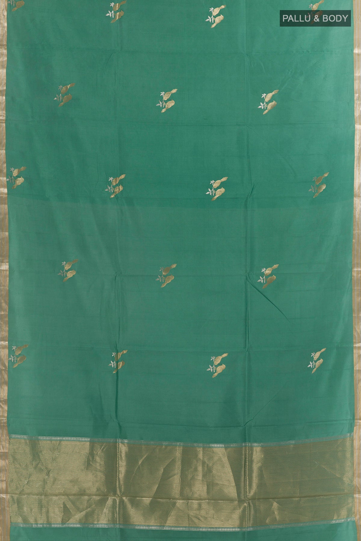 Flat view of Pure Silk Green Banarasi Katan Saree with Zari Butta on the body and Zari Border. 