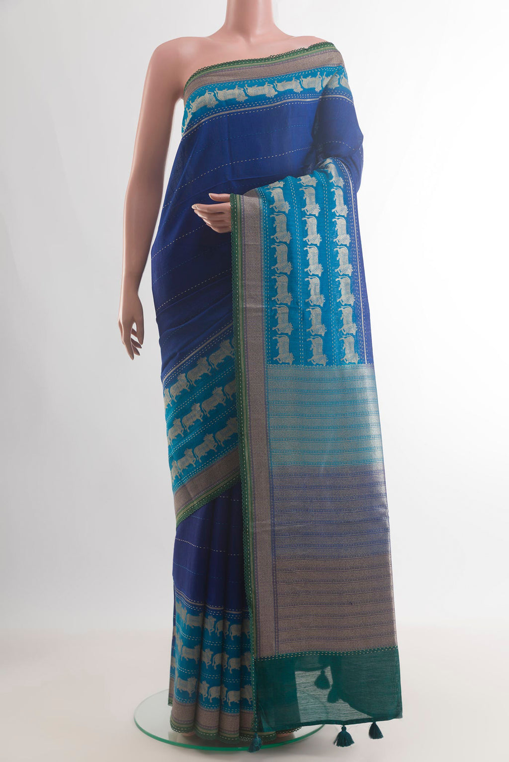 Blue Tussar Saree with Embroidery on the body and Embroidery Border.  displayed on a mannequin