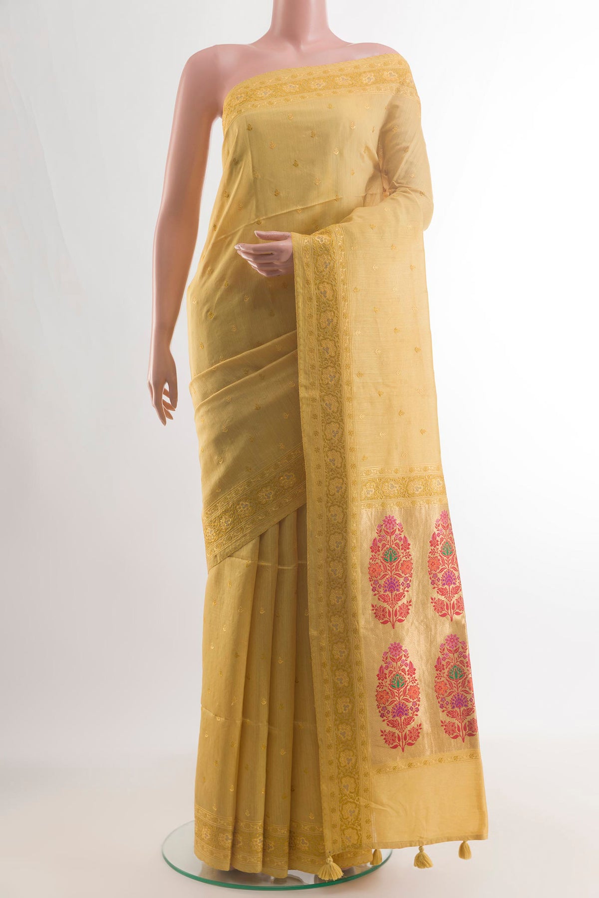 Yellow Tussar Saree with Embroidery on the body and Embroidery Border.  displayed on a mannequin