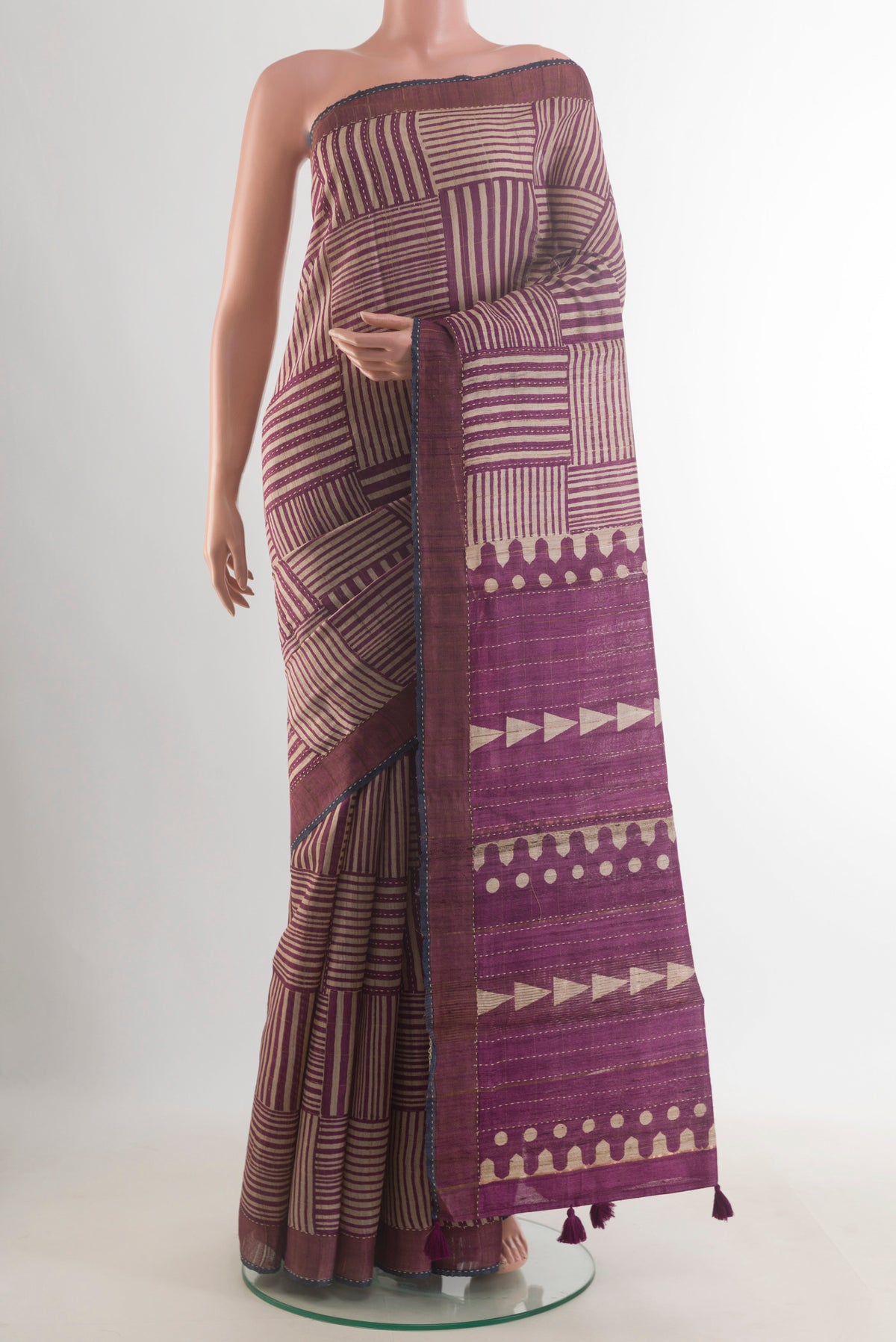 Beige Tussar Saree with Geometric Print on the body and Zari Border.  displayed on a mannequin