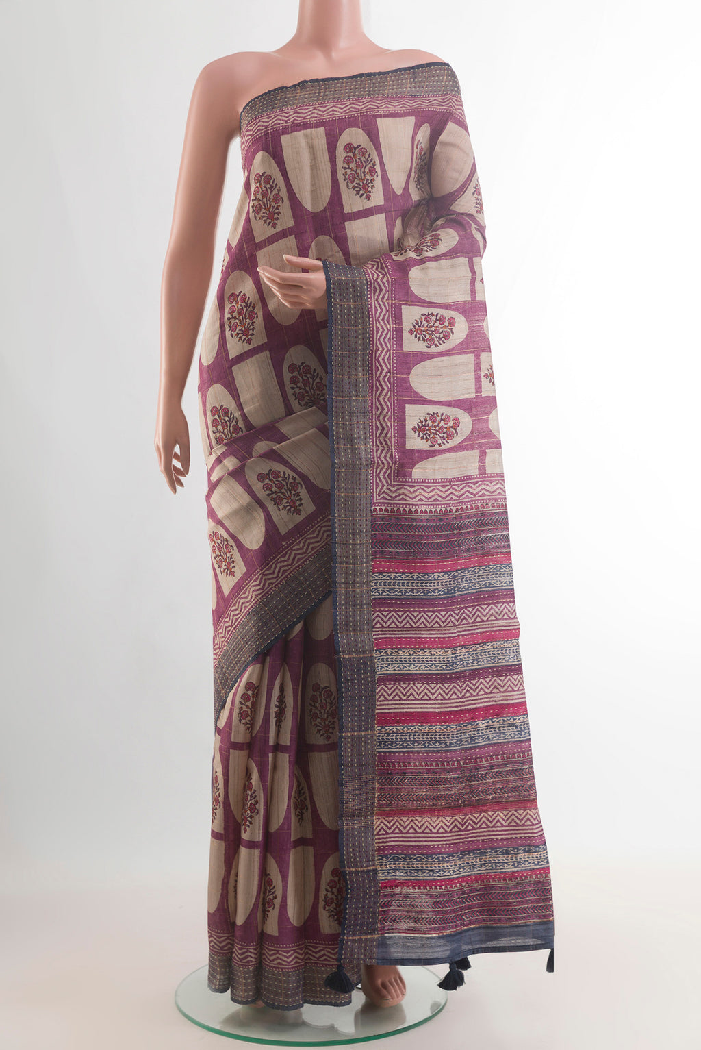 Mauve Tussar Saree with Printed design on the body and Zari Border.  displayed on a mannequin