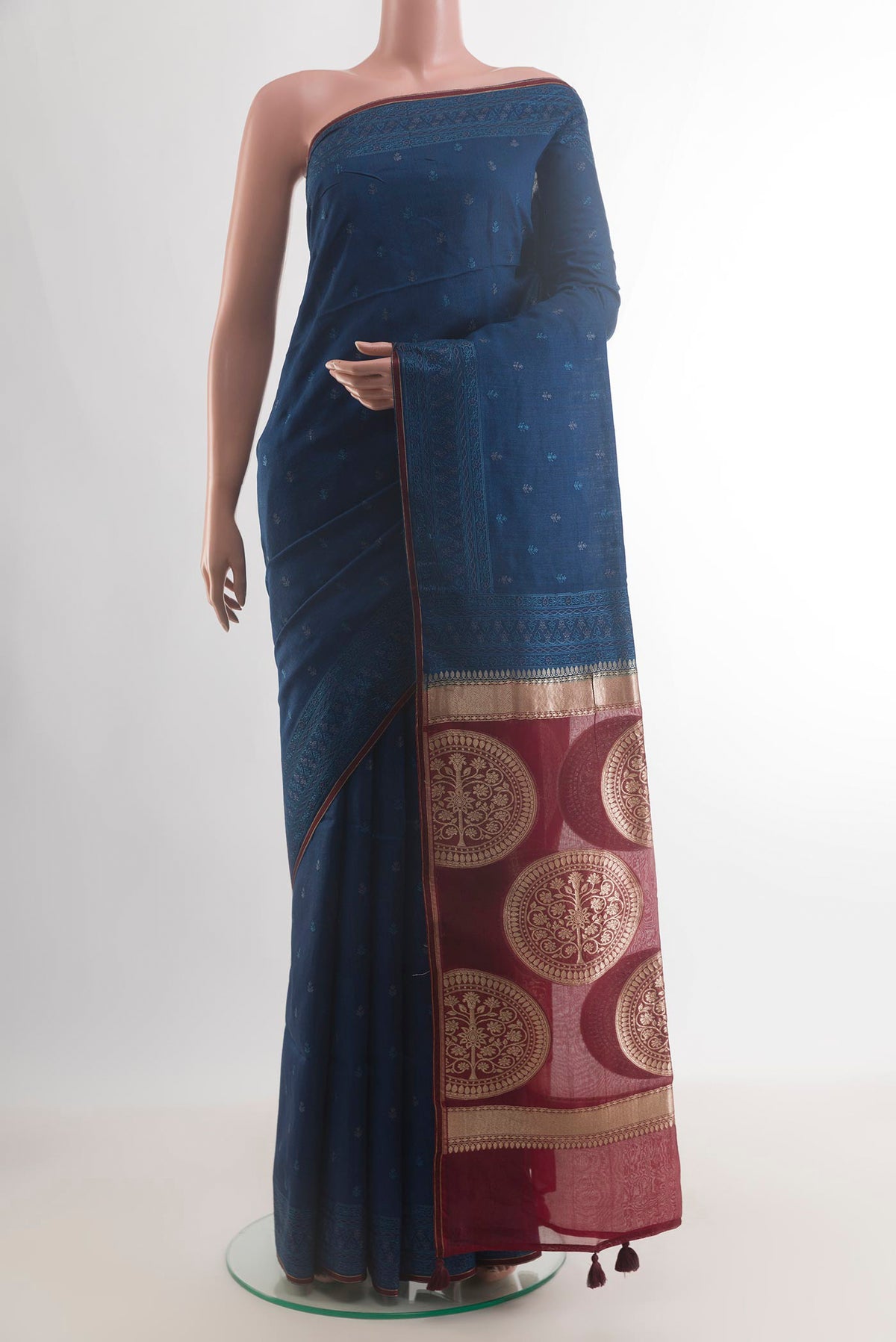 Blue Tussar Saree with Embroidery on the body and Embroidery Border.  displayed on a mannequin