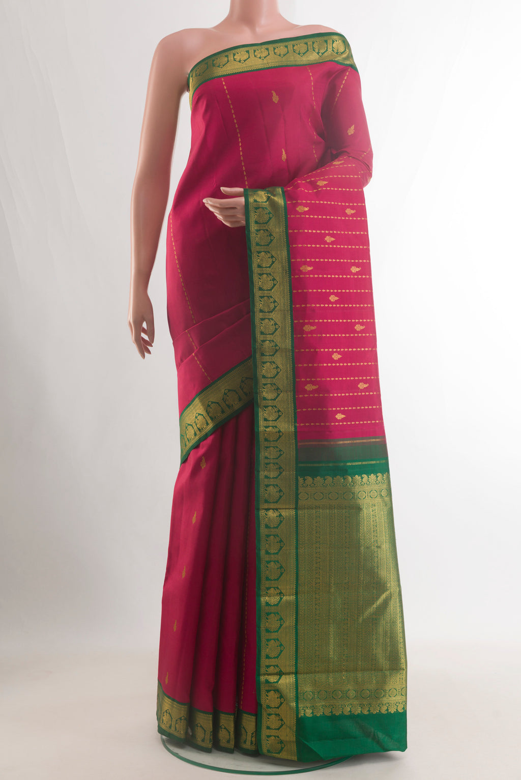 Pure Silk Red Kanjivaram Saree with Zari Butta on the body and Zari Border.  displayed on a mannequin