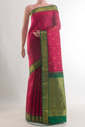 Pure Silk Red Kanjivaram Saree with Zari Butta on the body and Zari Border.  displayed on a mannequin