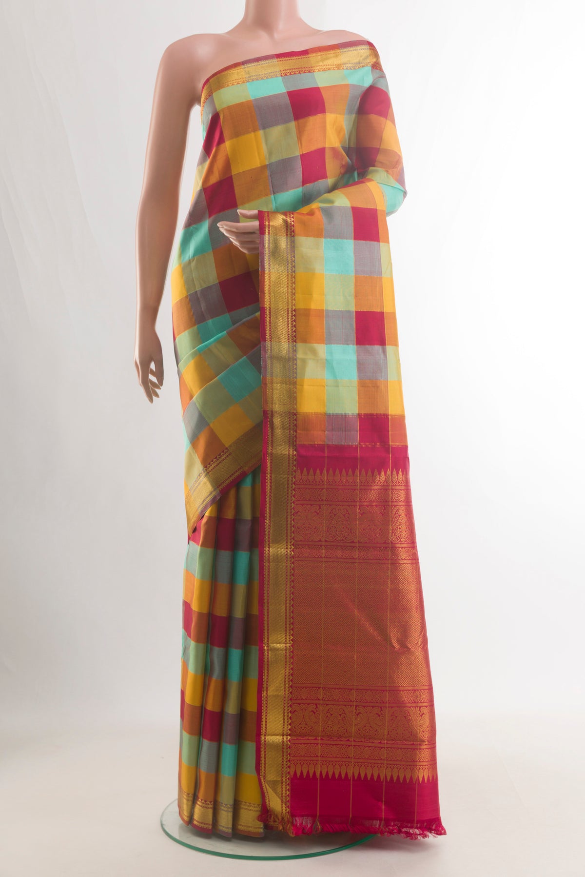 Pure Silk Multi Color Kanchipuram Saree with Checked design on the body and Zari Border.  displayed on a mannequin
