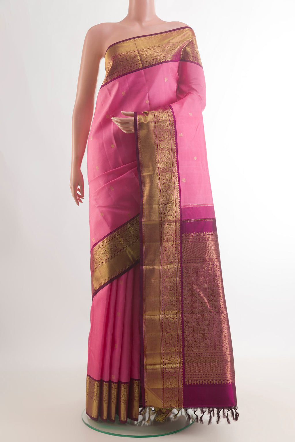 Pure Silk Pink Kanjivaram Saree with Zari Butta on the body and Zari Border.  displayed on a mannequin