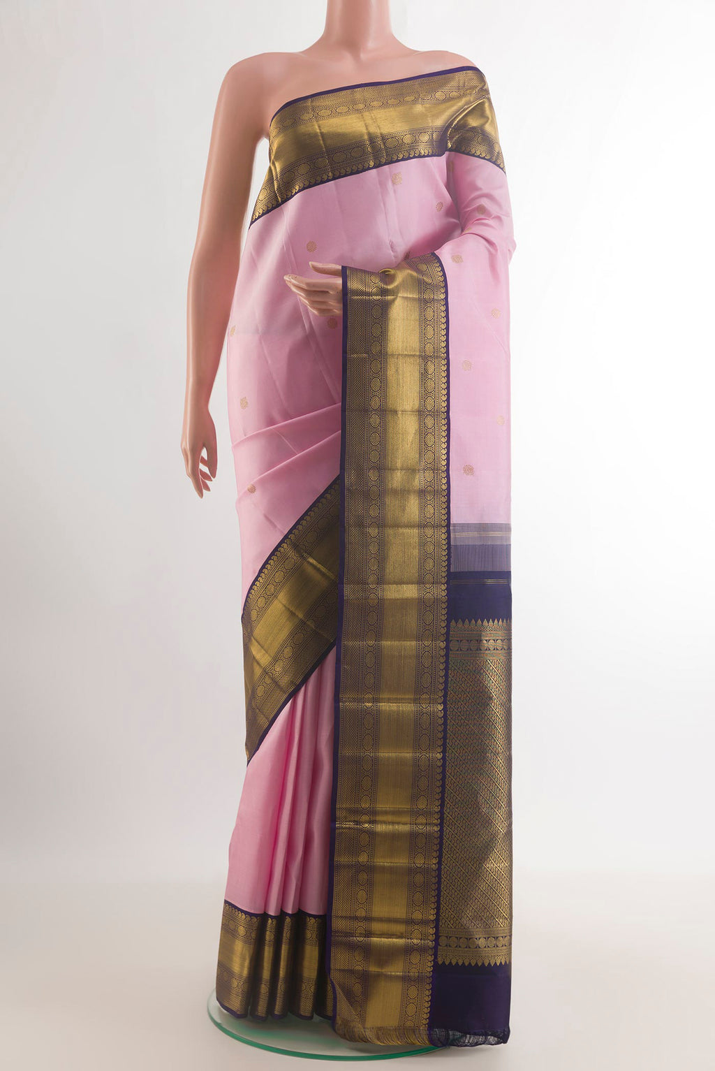 Pure Silk Rose pink Kanchipuram Saree with Zari Butta on the body and Zari Border.  displayed on a mannequin