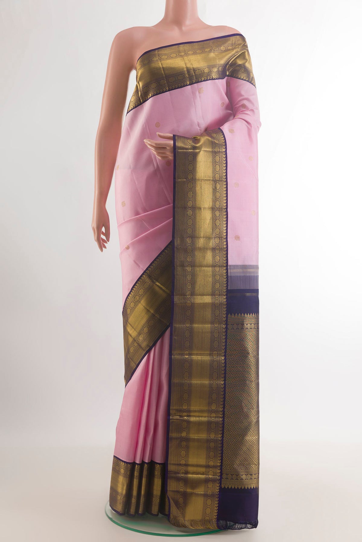 Pure Silk Rose pink Kanchipuram Saree with Zari Butta on the body and Zari Border.  displayed on a mannequin