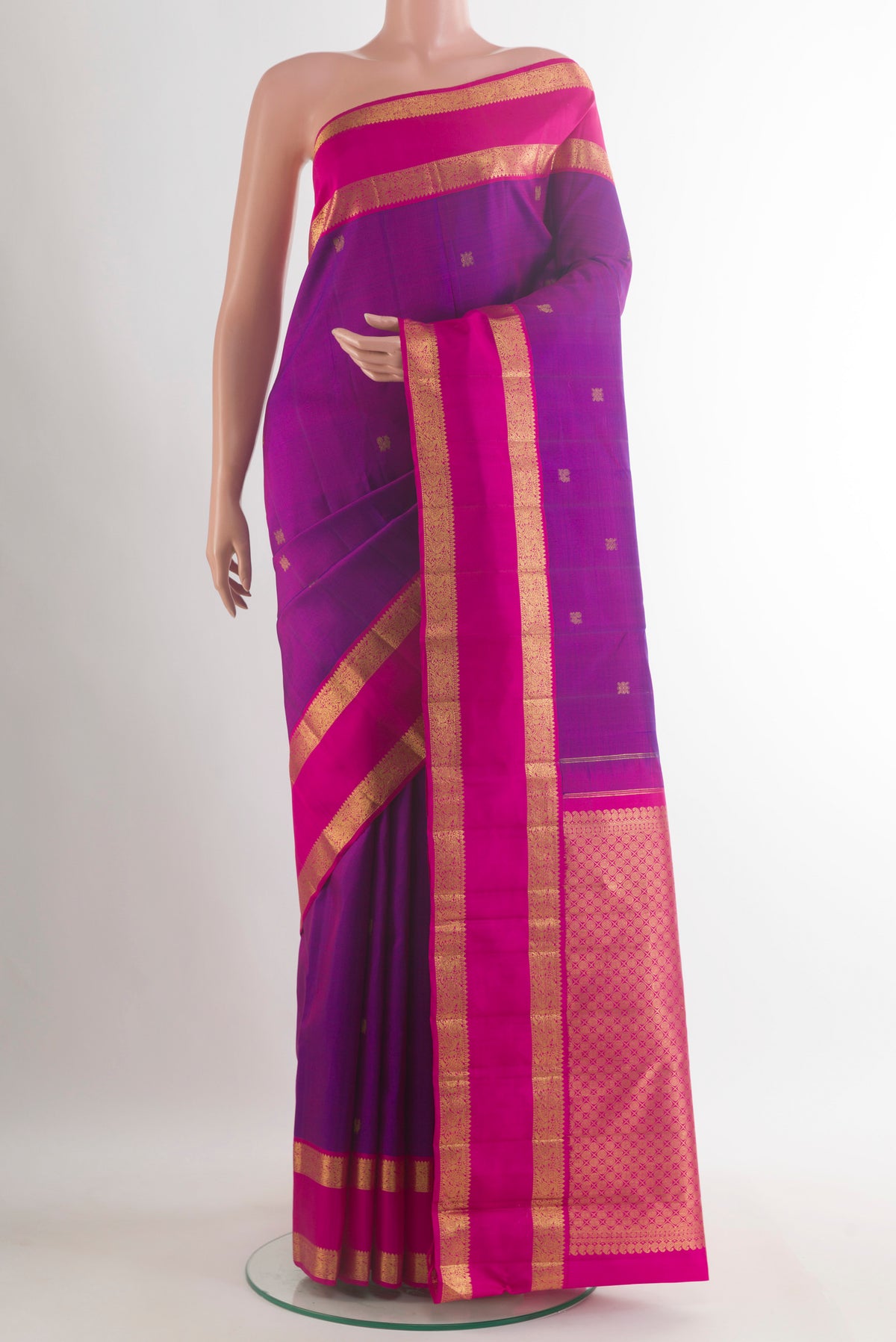 Pure Silk Purple Kanjivaram Saree with Zari Butta on the body and Zari Border.  displayed on a mannequin