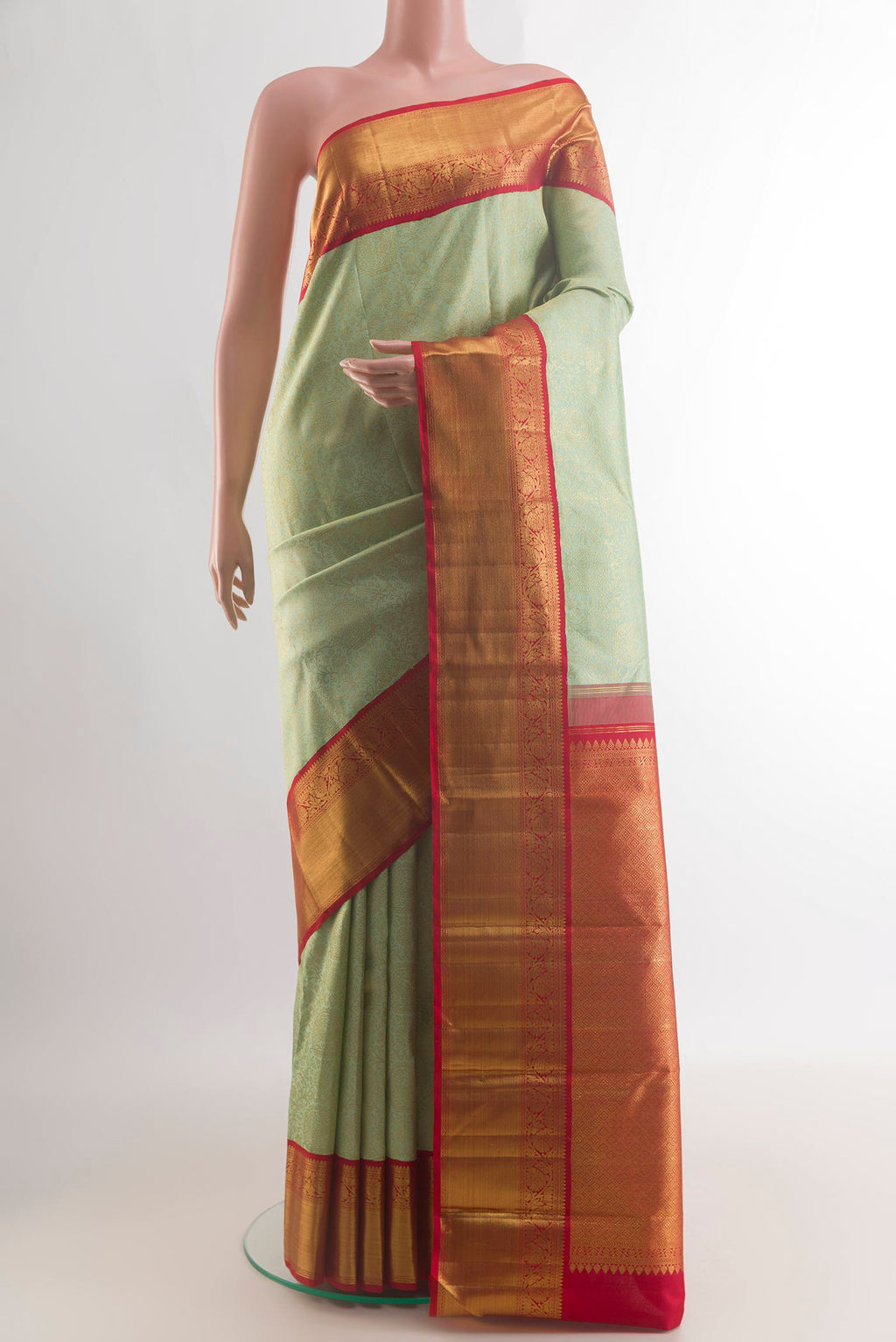 Pure Silk Light Green Kanchipuram Saree with Zari Brocade on the body and Zari Border.  displayed on a mannequin