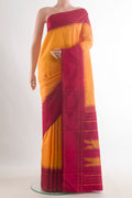 Pure Silk Yellow Kanjivaram Saree with Plain Body and Plain Border.  displayed on a mannequin