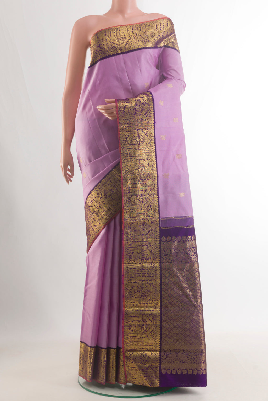 Pure Silk Lavender Kanjivaram Saree with Zari Butta on the body and Zari Border.  displayed on a mannequin