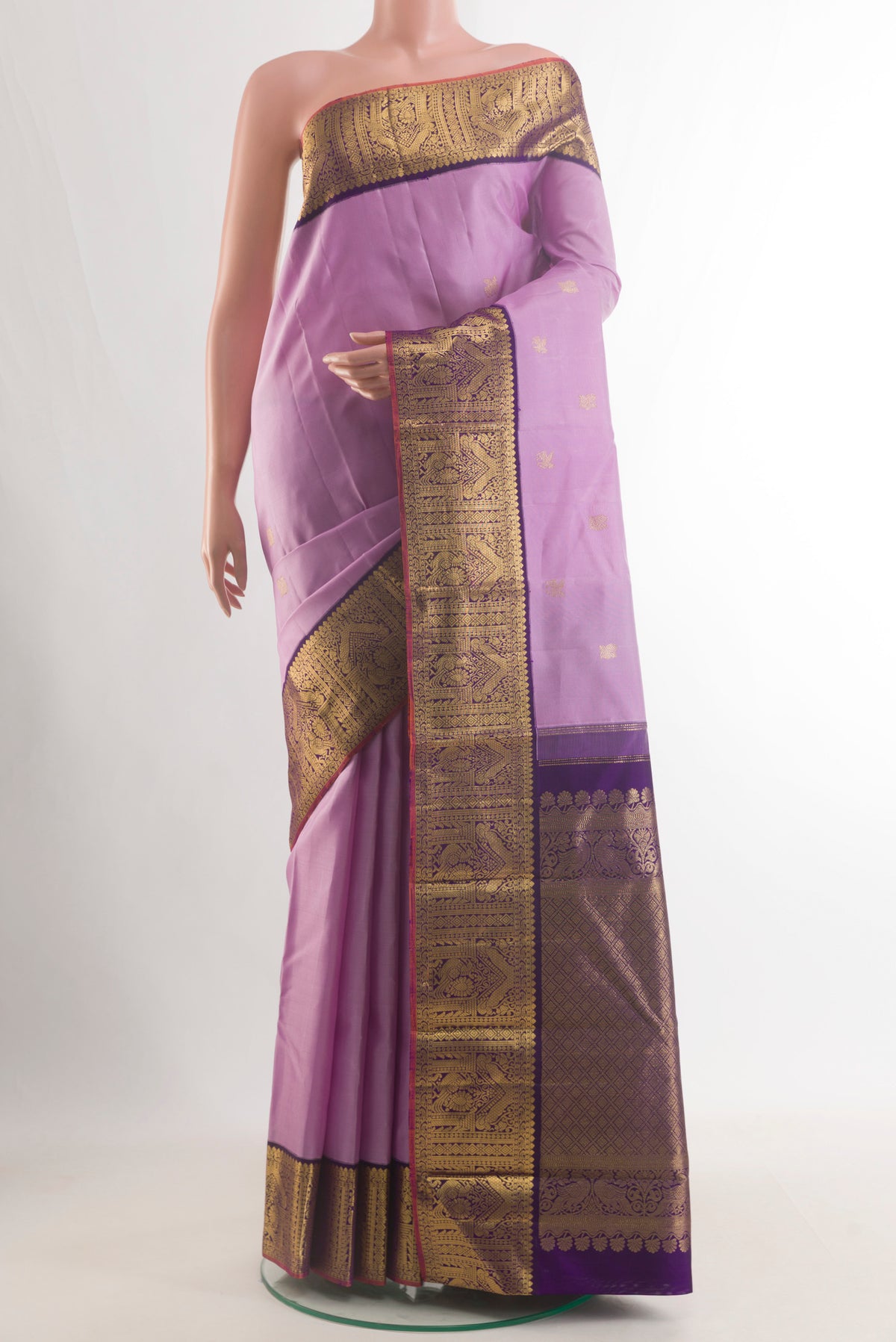 Pure Silk Lavender Kanjivaram Saree with Zari Butta on the body and Zari Border.  displayed on a mannequin